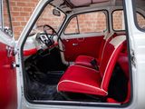 a red and white car with a red seat and steering wheel