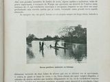 an open book with a picture of two people in a canoe