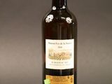 a bottle of wine that is sitting on a table