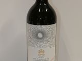 a bottle of wine that is sitting on a table