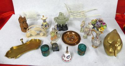 many different types of figurines on a white cloth