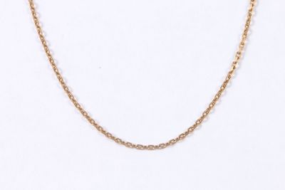 a close up of a gold chain necklace on a white background
