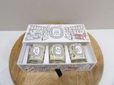 three soap bars in a box on a wooden stand
