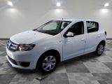 a picture of a white car parked in a garage