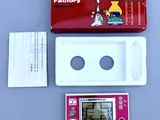 a nintendo game console with a game on it and a box