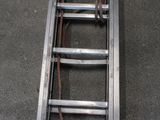 a metal ladder that is sitting on the ground