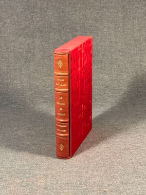two red books sitting on top of each other on a table