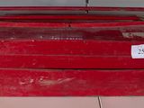 a red tool box sitting on the floor next to a red tool box