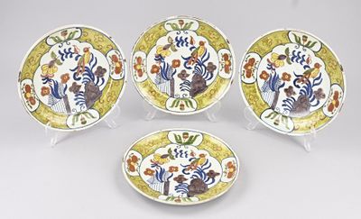 three plates with different designs on them on a white surface