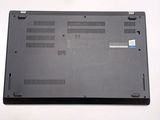 a close up of a laptop on a white surface