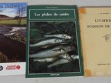 three books on a table, one of which is a fish and the other of which is a river