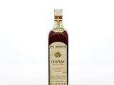 a close up of a bottle of wine on a white surface