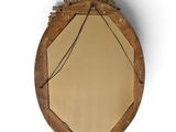 a mirror that is hanging on the wall in the room