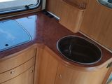a kitchen with a sink and a window in it