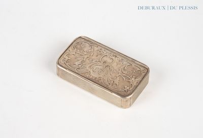 a silver box with a design on it on a white surface