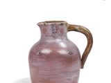 a brown vase with a handle on a white background