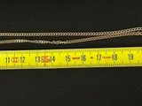 a measuring tape next to a pair of scissors on a table