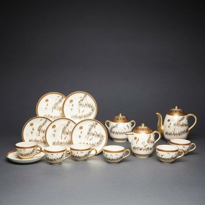 a group of porcelain tea and coffee cups and saucers