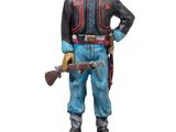 figurine of a soldier with a gun on a wooden base