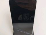 a close up of a black phone on a stand