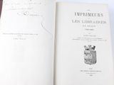 an open book with a drawing of a vase on it
