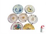 six plates with different designs on them on a white surface