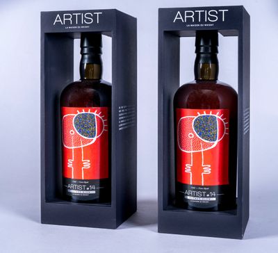 two bottles of wine in a black box on a white background