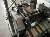 an image of a machine that is working on a conveyor belt