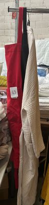 a lot of blankets on a table in a room