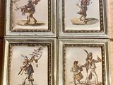 four framed pictures of a man carrying a plane and a woman carrying a child