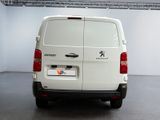 a white van that is parked in a room