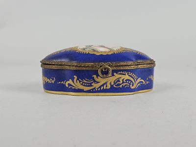 an image of a blue and gold box sitting on top of a table