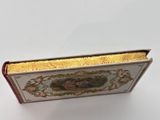 a small box with a picture on it on a white surface