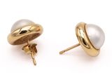 a pair of pearl and gold earrings on a white background