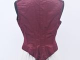 the back of a white dress with a red vest on a mannequin dummy