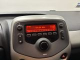a car dashboard with a digital clock on it