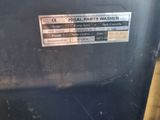 a close up of a metal container with a sticker on it