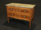 a small chest of drawers with marble top on a black background