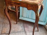 a small table with a mirror on top of it