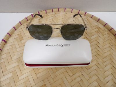 a pair of sunglasses sitting on top of a white case