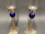 pair of silver and blue glass candlesticks on stands