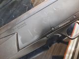 a gun that is sitting on a table in a room
