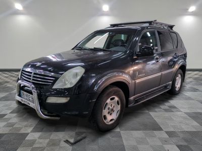 a picture of a black suv parked in a garage