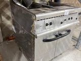 an old stove with a metal pan on top of it