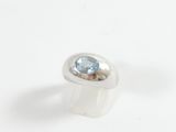 an image of a ring with a blue topaz stone in it