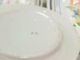 a close up of a plate with a number on it