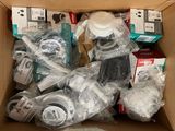a cardboard box full of electronic devices and other items