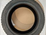 a tire that is sitting on top of a cardboard box