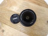 a camera lens sitting on top of a wooden table