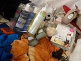 a pile of stuff that is sitting on a bed